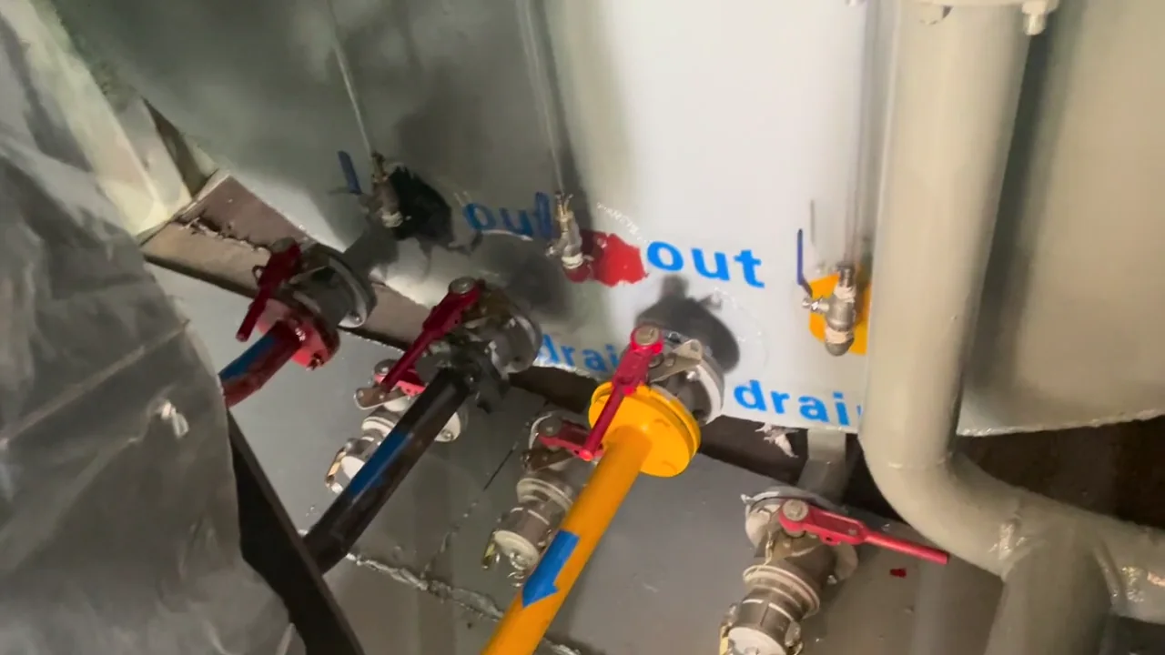 Valve and pipe connections inside a customized containerized fuel station.